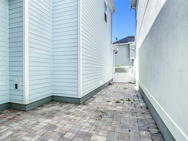 1513 Resolute St, Celebration, FL 34747 - view of side of home featuring a patio area and a gate