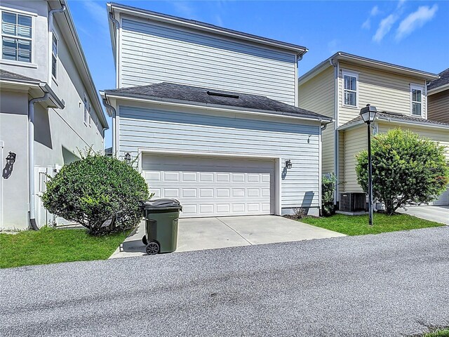1513 Resolute St, Celebration, FL 34747 - traditional-style house with concrete driveway and an attached garage