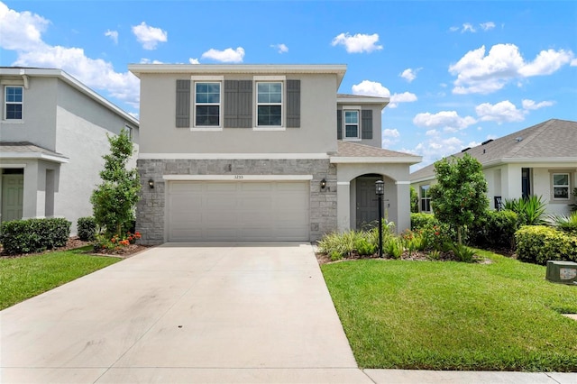 3255 Hilltop Cir, Bradenton, FL 34211 - traditional home featuring stone siding, driveway, stucco siding, a front lawn, and a garage
