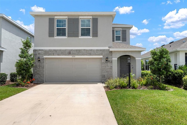 3255 Hilltop Cir, Bradenton, FL 34211 - traditional-style home with stone siding, stucco siding, a front yard, driveway, and an attached garage