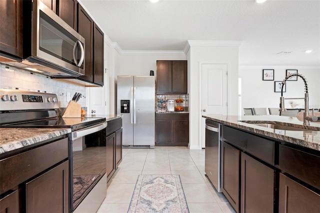 3255 Hilltop Cir, Bradenton, FL 34211 - kitchen with stainless steel appliances, ornamental molding, decorative backsplash, dark brown cabinets, and stone counters