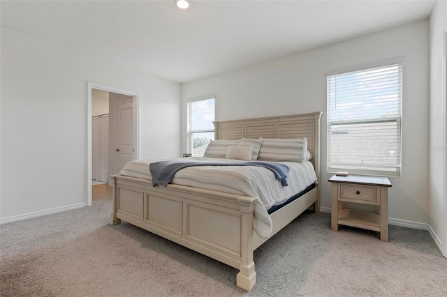 3255 Hilltop Cir, Bradenton, FL 34211 - bedroom featuring light carpet and baseboards