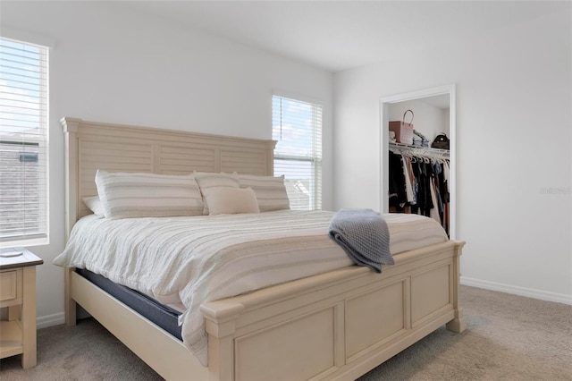 3255 Hilltop Cir, Bradenton, FL 34211 - bedroom with light colored carpet, a walk in closet, and a closet