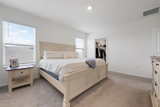 3255 Hilltop Cir, Bradenton, FL 34211 - bedroom with light carpet, a spacious closet, and a closet