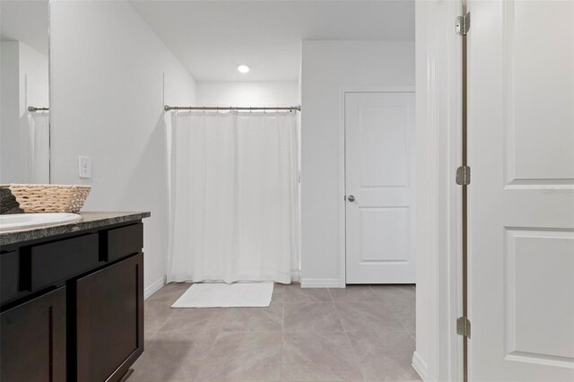 3255 Hilltop Cir, Bradenton, FL 34211 - bathroom featuring vanity, curtained shower, tile patterned floors, and recessed lighting