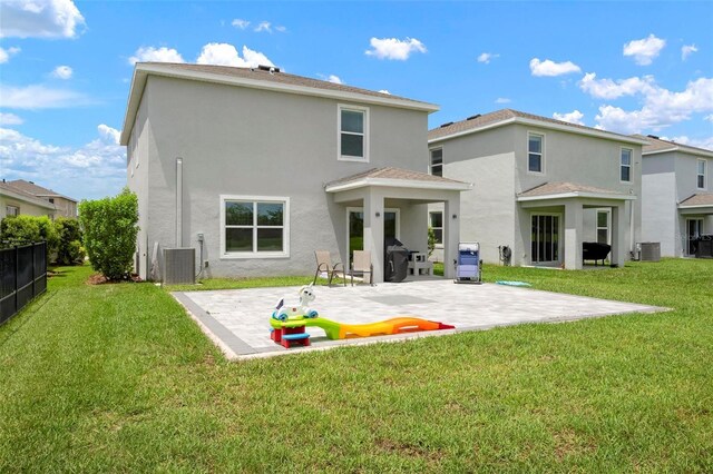 3255 Hilltop Cir, Bradenton, FL 34211 - back of house featuring stucco siding and a patio