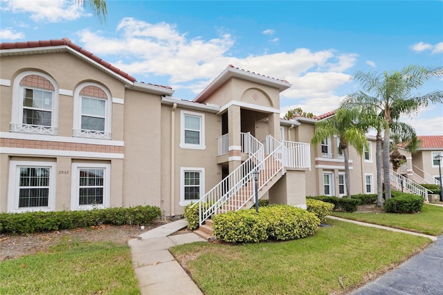 2832 Osprey Cove Pl Unit 102, Kissimmee, FL 34746 - view of building exterior with stairway