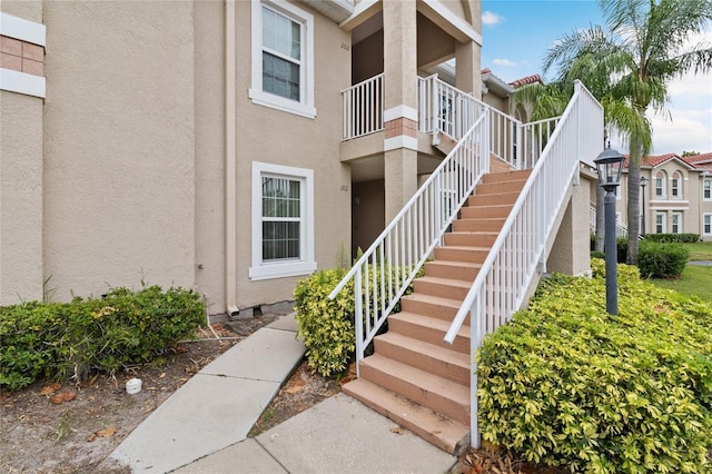 2832 Osprey Cove Pl Unit 102, Kissimmee, FL 34746 - view of building exterior featuring stairs