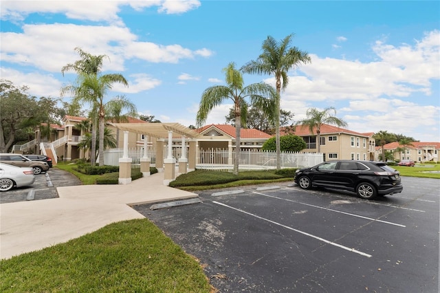 2832 Osprey Cove Pl Unit 102, Kissimmee, FL 34746 - uncovered parking lot featuring a residential view