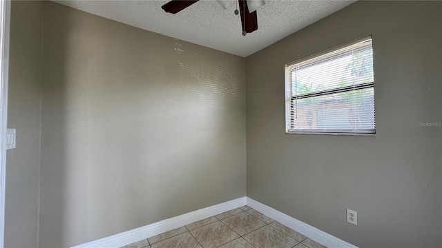 2326 St Marteen Ct, Kissimmee, FL 34741 - spare room with a ceiling fan, light tile patterned flooring, and a textured ceiling