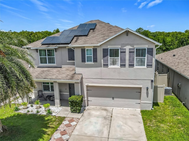 209 Willow Bend Dr, Davenport, FL 33897 - traditional-style home featuring stucco siding, driveway, an attached garage, a front lawn, and a shingled roof