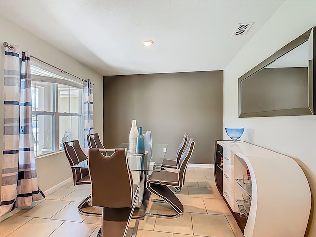 209 Willow Bend Dr, Davenport, FL 33897 - dining area with light tile patterned floors and recessed lighting