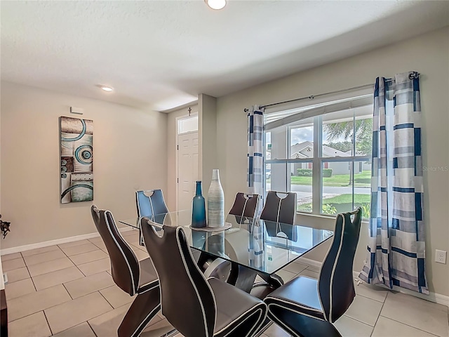 209 Willow Bend Dr, Davenport, FL 33897 - dining space with light tile patterned floors and recessed lighting