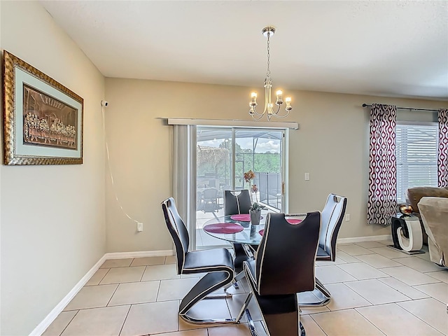209 Willow Bend Dr, Davenport, FL 33897 - dining area featuring a chandelier and light tile patterned flooring