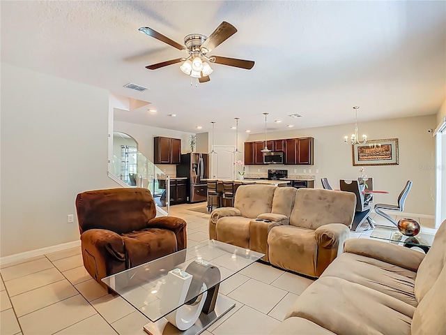 209 Willow Bend Dr, Davenport, FL 33897 - living room with a chandelier, ceiling fan, and light tile patterned flooring