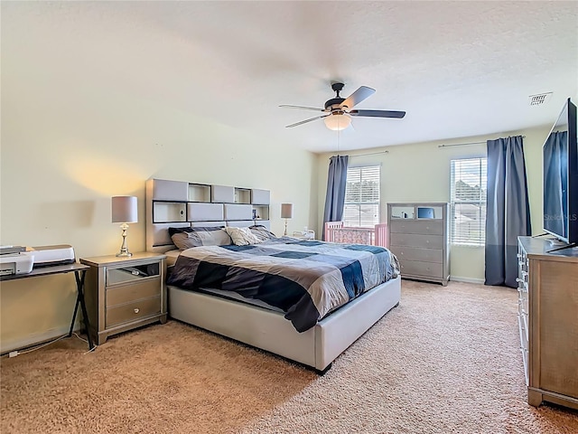 209 Willow Bend Dr, Davenport, FL 33897 - bedroom with light colored carpet and ceiling fan