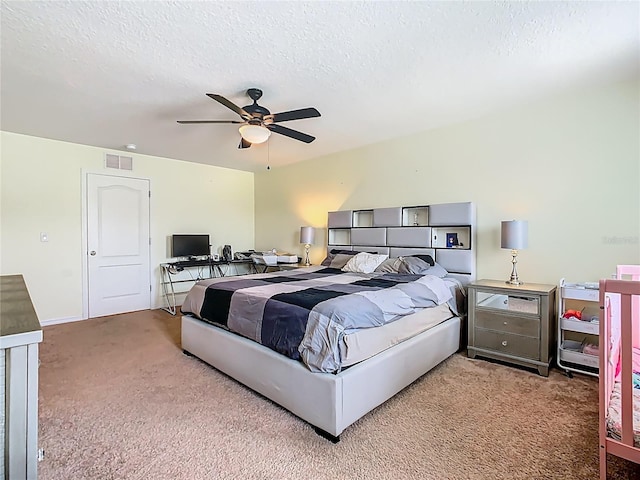 209 Willow Bend Dr, Davenport, FL 33897 - bedroom featuring carpet flooring, a textured ceiling, and a ceiling fan