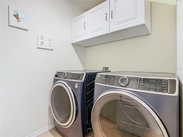 209 Willow Bend Dr, Davenport, FL 33897 - laundry room featuring cabinet space and washing machine and clothes dryer