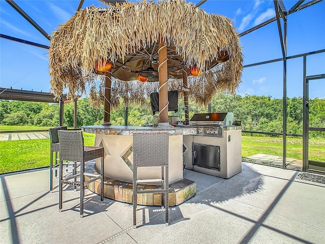 209 Willow Bend Dr, Davenport, FL 33897 - view of patio / terrace with a lanai and an outdoor kitchen