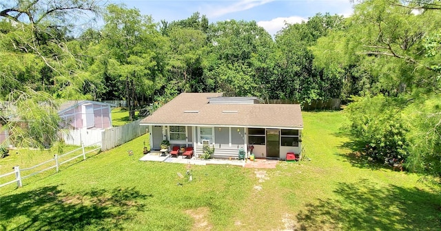 1431 Jack Calhoun Dr, Kissimmee, FL 34741 - rear view of property featuring a fenced backyard and roof with shingles