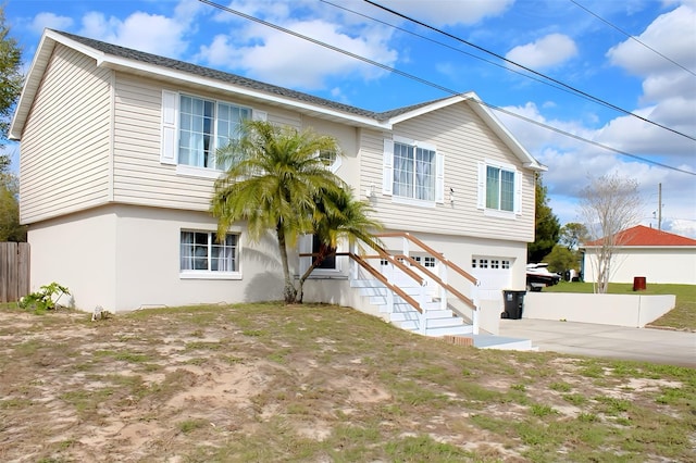 4151 Nelson Rd, Lake Wales, FL 33898 - view of front of property featuring concrete driveway, a garage, and stucco siding