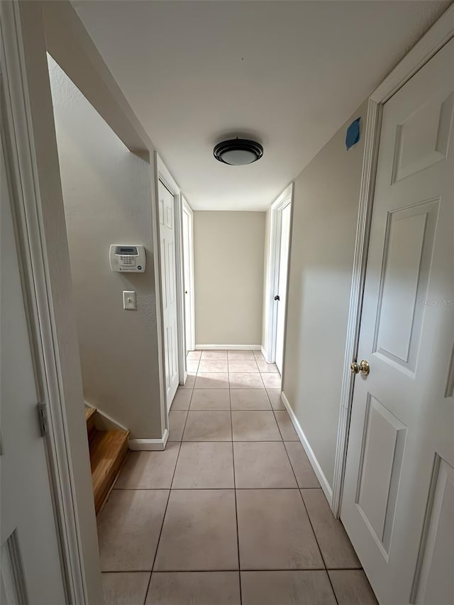 4151 Nelson Rd, Lake Wales, FL 33898 - hall with light tile patterned flooring and stairway