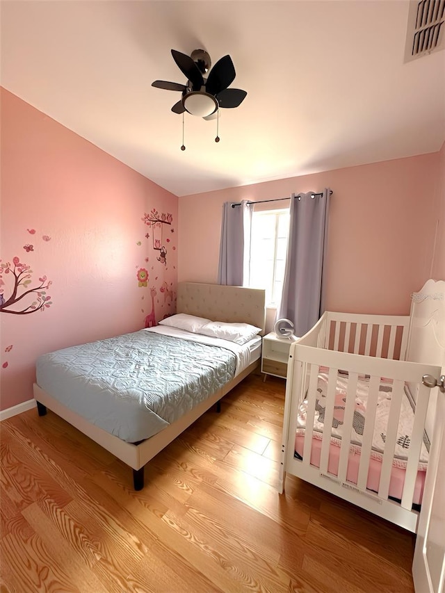 4151 Nelson Rd, Lake Wales, FL 33898 - bedroom featuring wood finished floors and a ceiling fan
