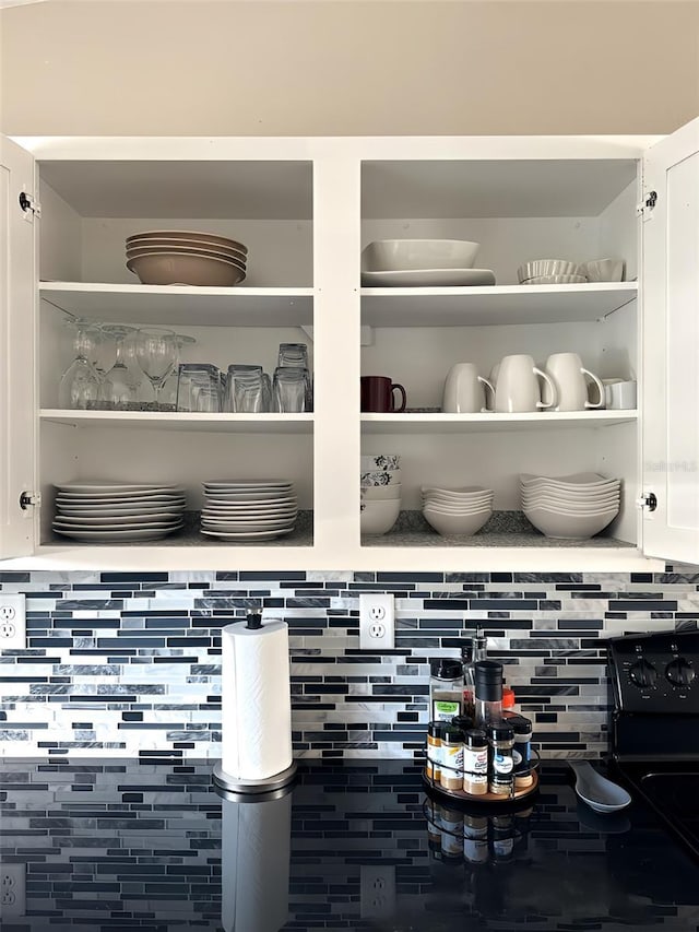 4151 Nelson Rd, Lake Wales, FL 33898 - kitchen view of open shelves, white cabinetry, and tasteful backsplash