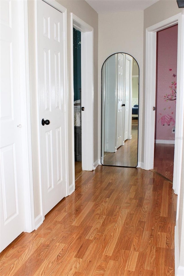 4151 Nelson Rd, Lake Wales, FL 33898 - unfurnished bedroom with arched walkways and light wood-type flooring