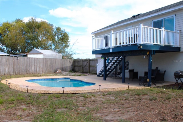 4151 Nelson Rd, Lake Wales, FL 33898 - view of pool with stairway, a fenced backyard, a deck, a patio, and area for grilling