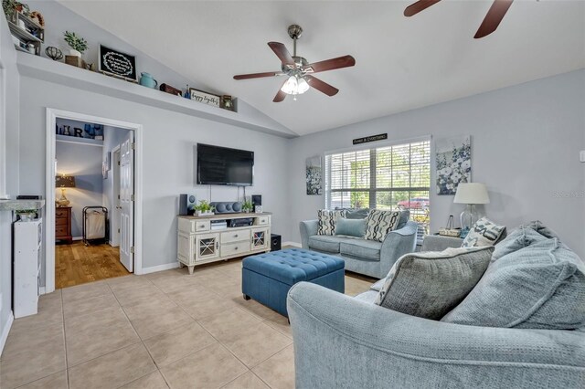 6396 Bennett Ct, Saint Cloud, FL 34771 - living room with ceiling fan, vaulted ceiling, and light tile patterned flooring