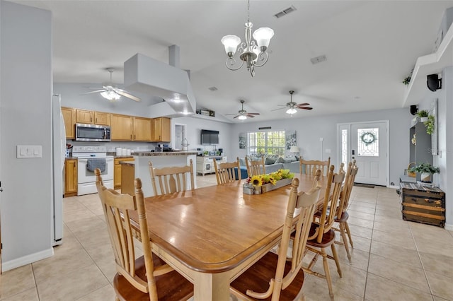 6396 Bennett Ct, Saint Cloud, FL 34771 - dining area with a ceiling fan, light tile patterned floors, vaulted ceiling, and a chandelier