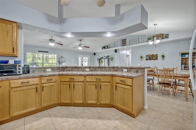 6396 Bennett Ct, Saint Cloud, FL 34771 - kitchen featuring light tile patterned floors, a ceiling fan, lofted ceiling, hanging light fixtures, and a chandelier