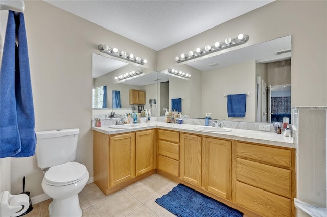 6396 Bennett Ct, Saint Cloud, FL 34771 - bathroom featuring tile patterned floors and double vanity
