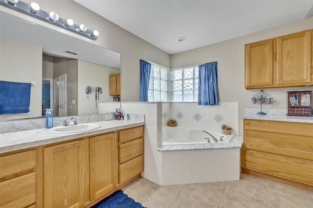 6396 Bennett Ct, Saint Cloud, FL 34771 - full bath featuring vanity, tile patterned floors, a garden tub, and a textured ceiling