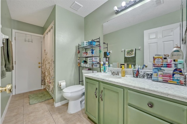 6396 Bennett Ct, Saint Cloud, FL 34771 - bathroom with vanity, tile patterned floors, and a textured ceiling
