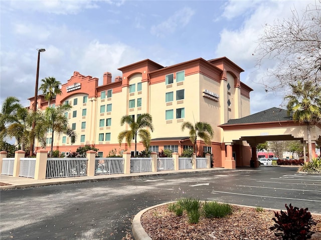 3000 Maingate Ln Unit 414, Kissimmee, FL 34747 - view of building exterior with uncovered parking