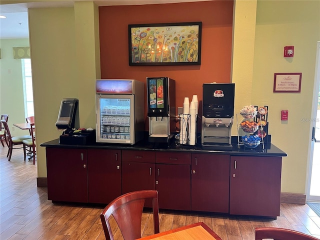 3000 Maingate Ln Unit 414, Kissimmee, FL 34747 - bar area with light wood-style floors and baseboards
