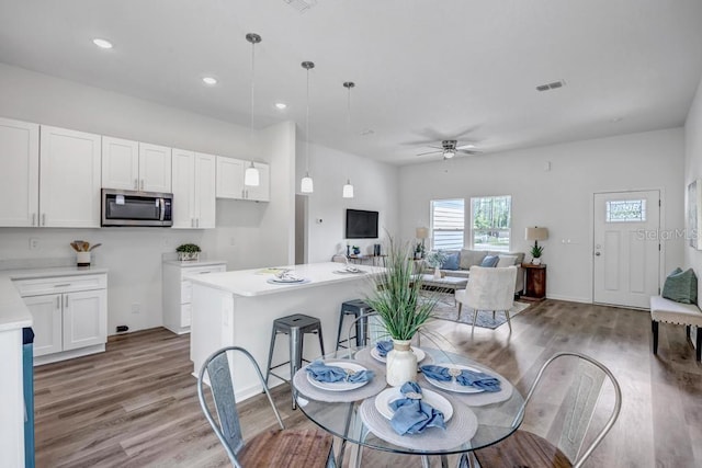 4410 Vicky St, Hastings, FL 32145 - dining room with light wood finished floors, ceiling fan, and recessed lighting