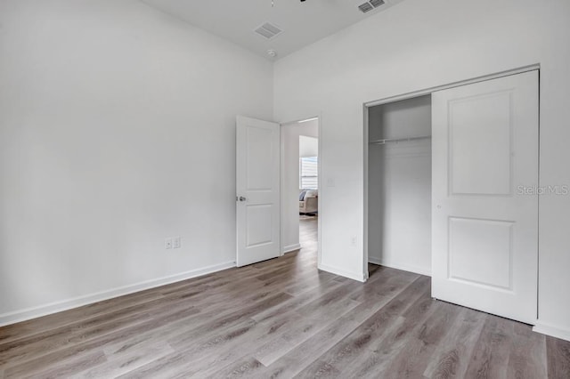 4410 Vicky St, Hastings, FL 32145 - unfurnished bedroom with wood finished floors and a closet