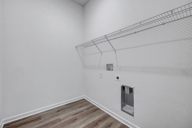 4410 Vicky St, Hastings, FL 32145 - laundry area with hookup for an electric dryer, hookup for a washing machine, wood finished floors, and heating unit