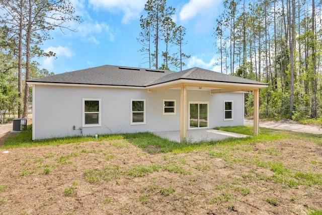4410 Vicky St, Hastings, FL 32145 - rear view of property with a patio, stucco siding, and a shingled roof