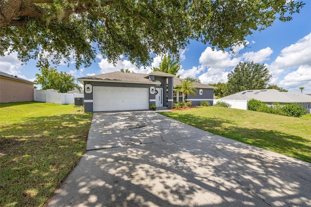 138 Hidden Pointe Ln, Groveland, FL 34736 - view of front of home with stucco siding, an attached garage, and concrete driveway