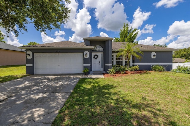138 Hidden Pointe Ln, Groveland, FL 34736 - single story home with stucco siding, a garage, concrete driveway, and a front yard