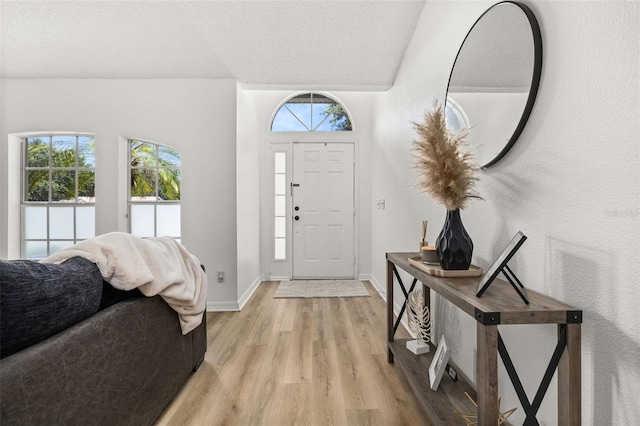 138 Hidden Pointe Ln, Groveland, FL 34736 - foyer featuring light wood-style flooring and baseboards
