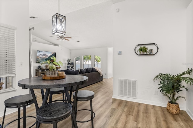 138 Hidden Pointe Ln, Groveland, FL 34736 - dining space with lofted ceiling, light wood-style floors, and ceiling fan