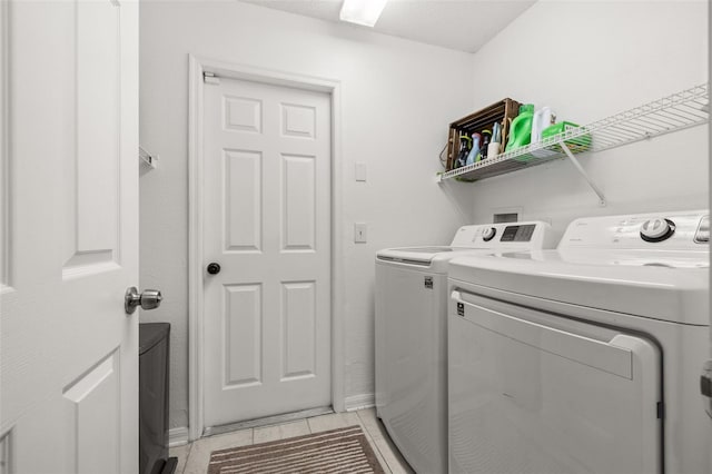 138 Hidden Pointe Ln, Groveland, FL 34736 - laundry area with washer and clothes dryer and light tile patterned floors