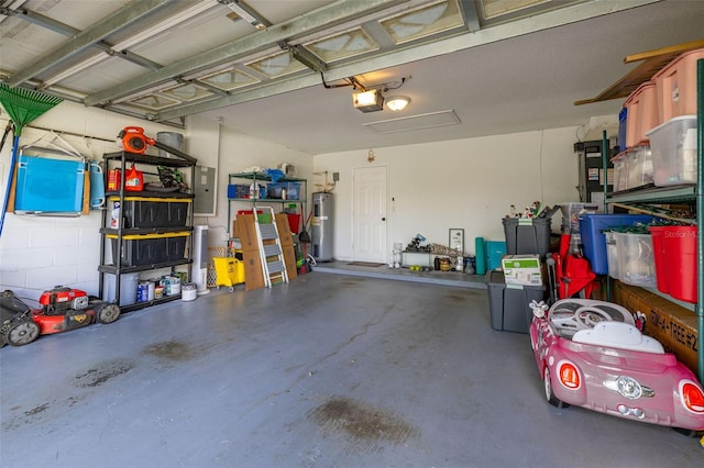 138 Hidden Pointe Ln, Groveland, FL 34736 - garage featuring electric water heater, electric panel, and a garage door opener