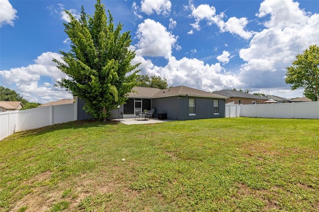 138 Hidden Pointe Ln, Groveland, FL 34736 - rear view of property featuring a patio, a fenced backyard, and stucco siding