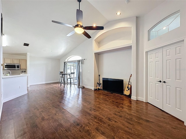 238 Sunridge Woods Blvd, Davenport, FL 33837 - unfurnished living room with high vaulted ceiling, ceiling fan, and dark wood-style flooring
